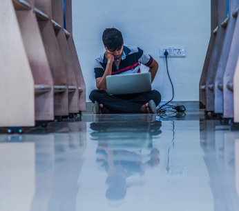 student is working on laptop